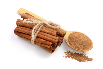 Cinnamon sticks bunch with powder isolated on white background. Top view