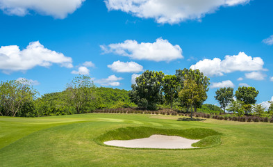 The sand Bungker in golf course with blue cloud sky background