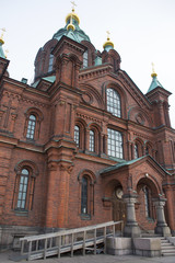 Fototapeta na wymiar View of Uspenski Cathedral. This is an Eastern Orthodox cathedral in Helsinki, Finland, dedicated to the Dormition of the Theotokos (the Virgin Mary). Designed by the Russian architect.