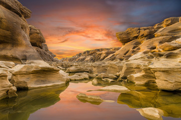 Fototapeta na wymiar The rock stone mountain with twilight sky background