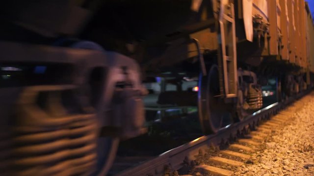 The wagons of the train are passing by. Close up.