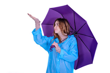 Young attractive woman in raincoat w on white