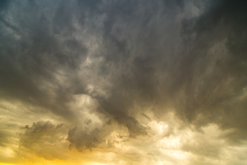Obraz premium Storm clouds in the sky at sunset as background