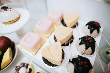 Delicious white wedding reception candy bar dessert table