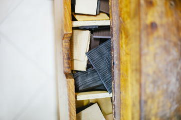 shoemaker workshop chest with pieces of sole seen from above