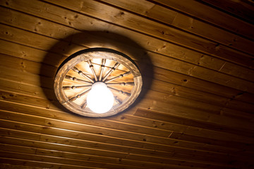 Lamp on a wooden ceiling