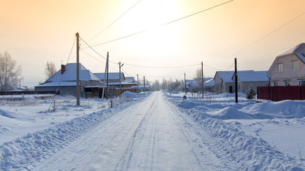 Road in the snow in the village