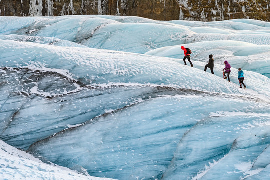 mountaineers hiking a glacier at vatnajokull, iceland
