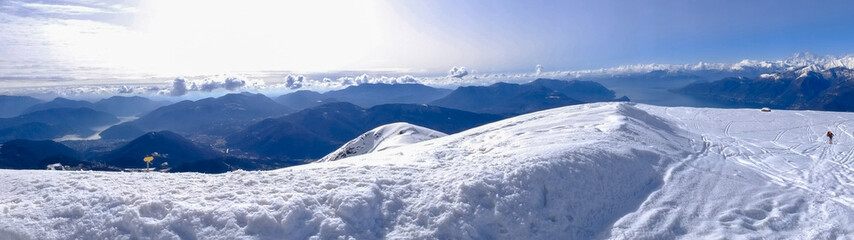 Obraz premium panoramic photo of mountain landscape mount Lema, snowy peak with signs of ski pass