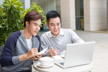 Asian Business people with casual suit working in coffee shop