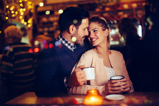 Romantic Couple Dating In Pub At Night