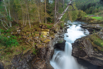 Waterfall  in forest in the norway