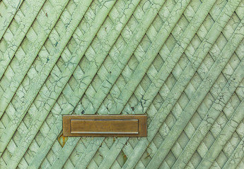 Texture of the old green metal door with cracked