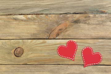 Red paper hearts on a wooden background. Valentine's Day. Copy space. Top view.