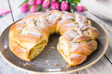 Sweet braided easter bread with marzipan and pistachio
