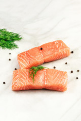 Slices of salmon with dill, peppercorns, and copyspace