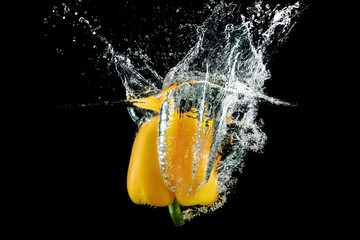 Fototapeta na wymiar bell pepper in water with splash