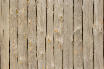 Wall maden of logs as a texture or background