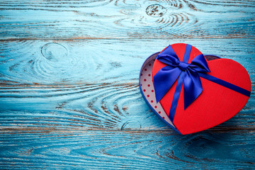 Valentines day background with present gift box in the form of a heart