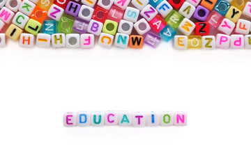 EDUCATION word and alphabet letter beads on white background for learning concept