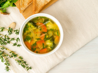 Delicious thick Soup with mixed vegetables - cauliflower, broccoli, carrots, potatoes, garlic, tomatoes.  Healthy diet food. Top view, copy space for text