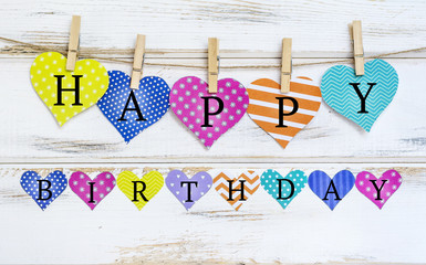 Happy Birthday Greeting Card with Colorful Paper Hearts on a White Wooden Background