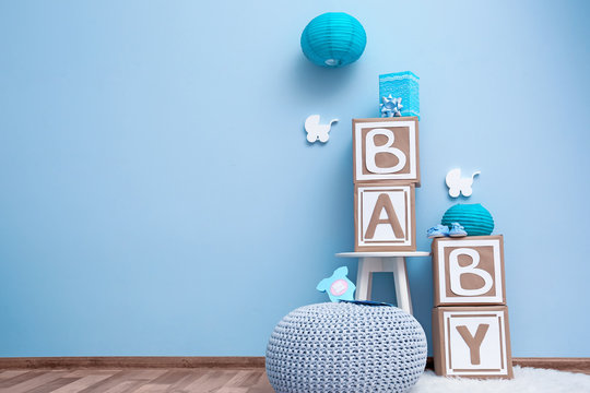 Beautiful decorations for baby shower party near color wall