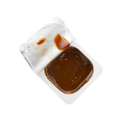 Plastic cup with chocolate yogurt on white background