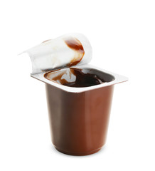 Plastic cup with chocolate yogurt on white background
