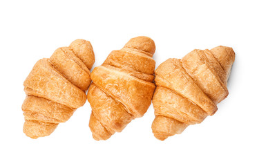 Tasty croissants on white background