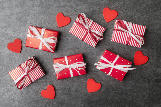 Set of gift boxes on Valentines day over dark stone background.