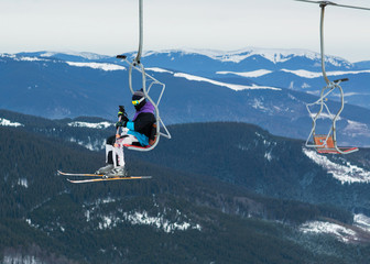 skier on a platform on a background of high snow mountains.