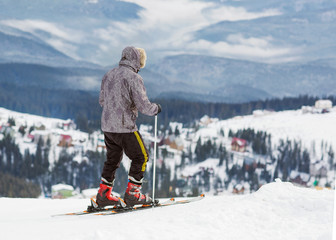 Fototapeta na wymiar skier is on a high mountain slope