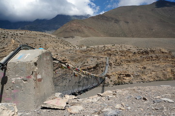 Concrete fastening of the pedestrian suspension bridge across the Kali Gandaki River, against the...