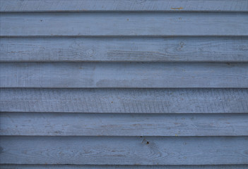 texture wooden planks blue background boards in the overlapping wooden fence