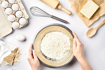 Hand sift flour. Bakery prepare for make cake. Top view