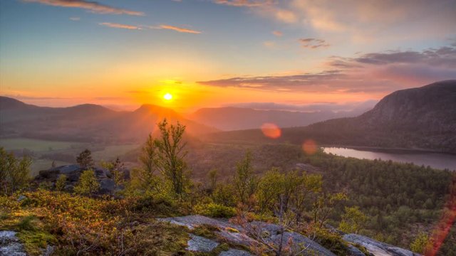 Timelapse of colorful sunset in Norwegian mountains over the lake Regnarvatnet