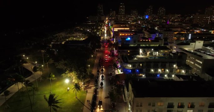Aerial flyover above Ocean Drive Miami Beach at night