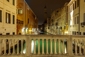Obraz premium small channel in lagoon city venice at night. long exposure Venezia Italy