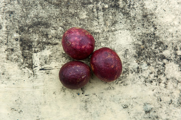 Fresh tropical Passion fruits on stone background