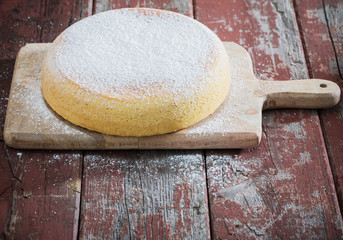 sponge cake on old wooden table.