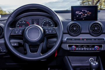 dashboard and steering wheel of modern car - Powered by Adobe