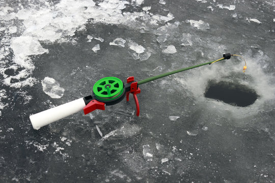 fishing rod in the ice-hole,  close up