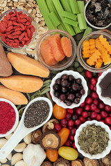 Health food concept for better brain power with fish, fruit, vegetables, seeds and herbs, super foods high in minerals, vitamins, antioxidants, anthocyanins, fibre and omega 3 fatty acids, top view.