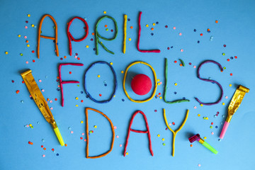 Funny font first april fools day written in plastecine of different colors.