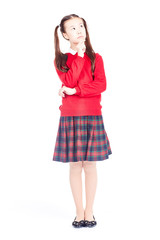 Asian female elementary student in school uniform posing on white background