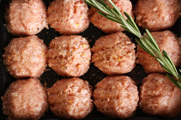 meatball forcemeat beef pork on wooden background rosemary