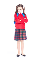 Asian female elementary student in school uniform posing on white background