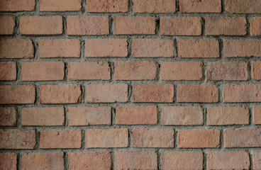 Red brick wall pattern. Grungy style and vignette.
