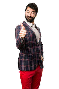 Well dressed man with thumb up on white background